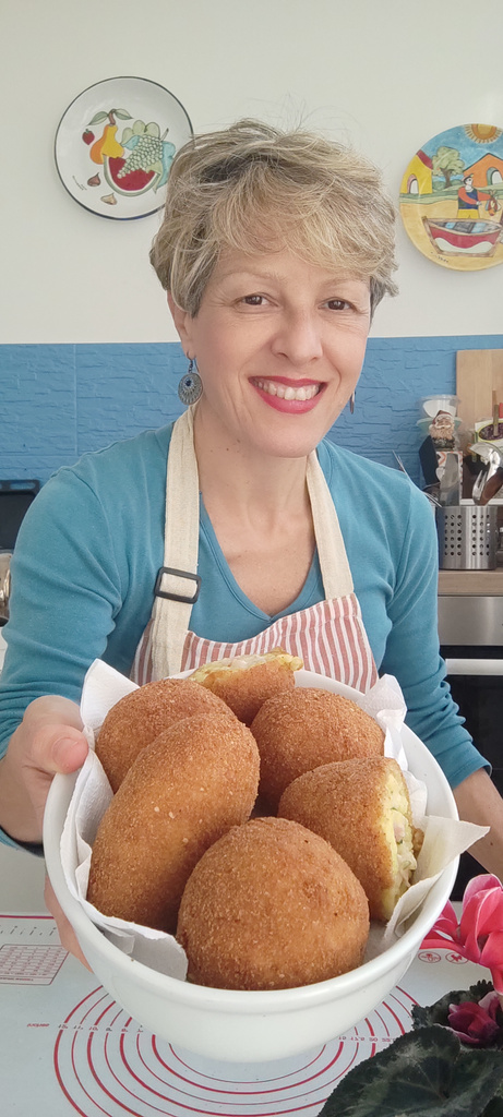 Ileana with freshly fried arancine
